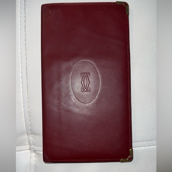 Cartier Handbags - Cartier long wallet/passport holder